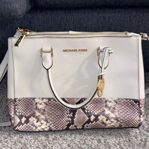 Michael Kors. Never used. Mid sized bag